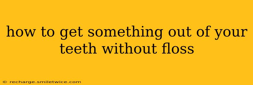how to get something out of your teeth without floss
